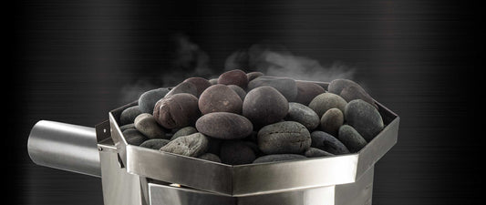 Steam rising from hot sauna rocks on a Scandia sauna heater